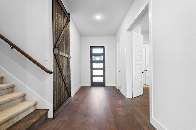 124 Craigmore Dr, Argyle, TX 76226 - foyer entrance with a barn door, dark wood-type flooring, baseboards, and stairs