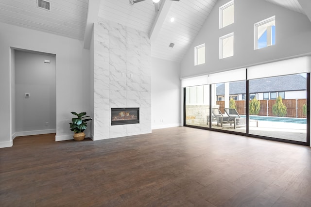 124 Craigmore Dr, Argyle, TX 76226 - unfurnished living room with high vaulted ceiling, plenty of natural light, wood finished floors, baseboards, and wooden ceiling