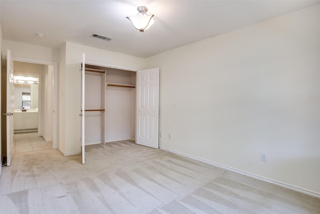 1112 Forest Creek St, Benbrook, TX 76126 - unfurnished bedroom with light colored carpet, baseboards, and a closet