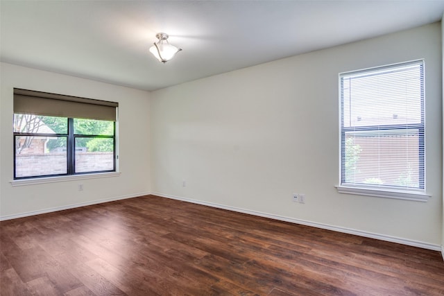 1112 Forest Creek St, Benbrook, TX 76126 - empty room with dark wood-style flooring and baseboards