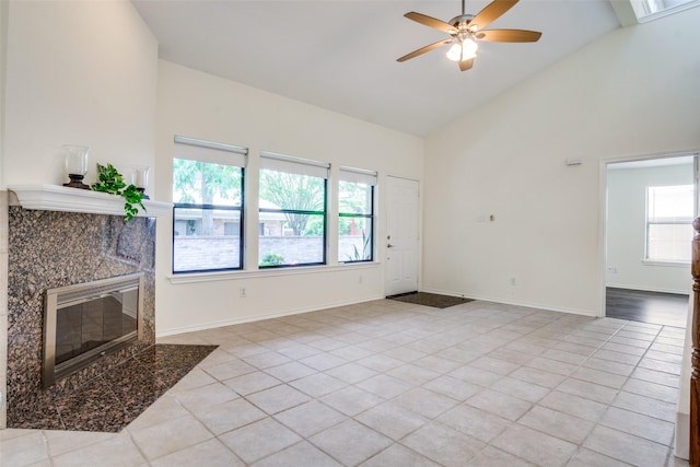 1112 Forest Creek St, Benbrook, TX 76126 - unfurnished living room with light tile patterned floors, high vaulted ceiling, ceiling fan, a fireplace, and baseboards