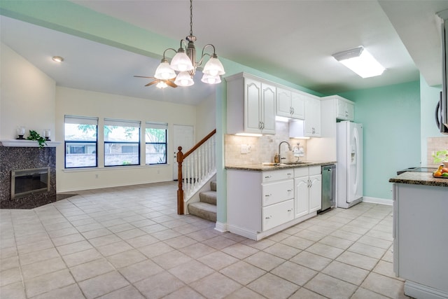 1112 Forest Creek St, Benbrook, TX 76126 - kitchen featuring white fridge with ice dispenser, a sink, open floor plan, and light tile patterned floors