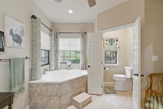 5925 Compass Way, Bluff Dale, TX 76433 - full bathroom featuring a garden tub, toilet, ceiling fan, tile patterned floors, and baseboards