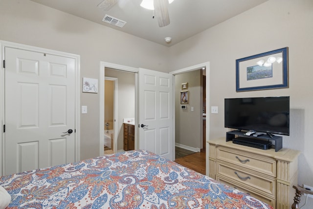 5925 Compass Way, Bluff Dale, TX 76433 - bedroom with wood finished floors, ensuite bathroom, baseboards, and ceiling fan