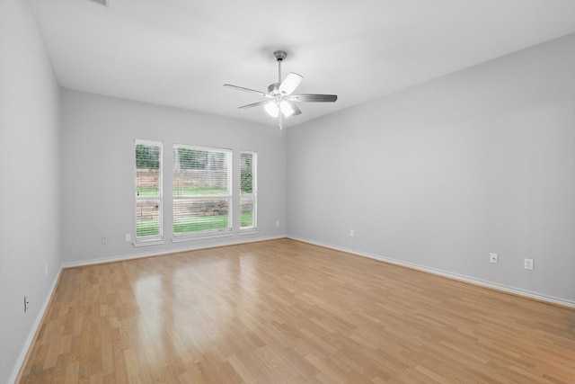 3812 Ridgemont Ln, Denton, TX 76210 - unfurnished room with light wood-style flooring, a ceiling fan, and baseboards