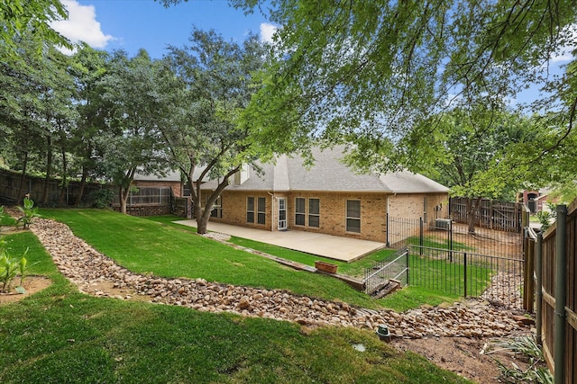 3812 Ridgemont Ln, Denton, TX 76210 - back of house with a patio, brick siding, and a shingled roof