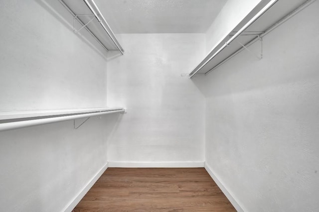 3008 Lindbergh Dr, Dallas, TX 75228 - walk in closet featuring wood finished floors