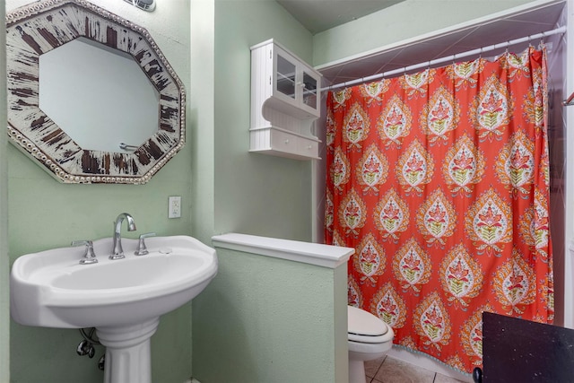 2011 Sandy Trl, Richardson, TX 75080 - bathroom with tile patterned flooring, a shower with curtain, toilet, and a sink