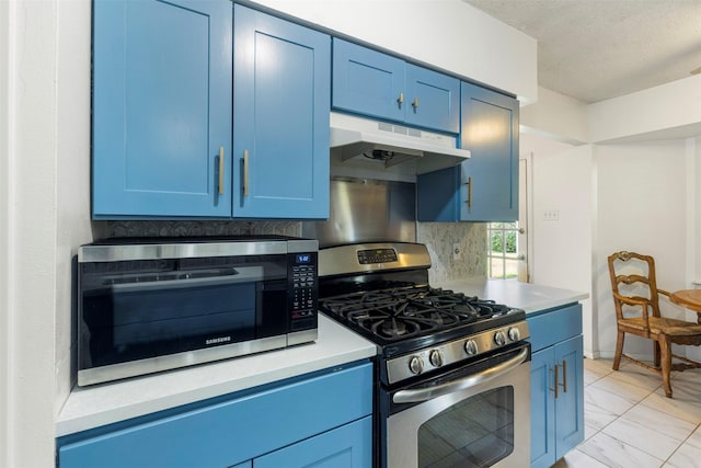 2011 Sandy Trl, Richardson, TX 75080 - kitchen with appliances with stainless steel finishes, under cabinet range hood, blue cabinetry, light countertops, and a textured ceiling