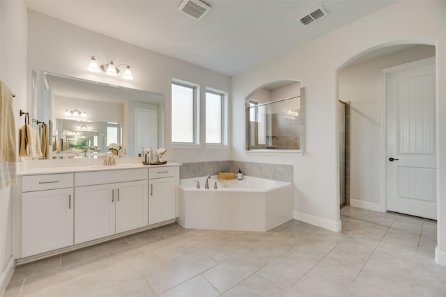 11578 Barcelona Ln, Frisco, TX 75035 - bathroom featuring a garden tub, vanity, a shower stall, and tile patterned flooring