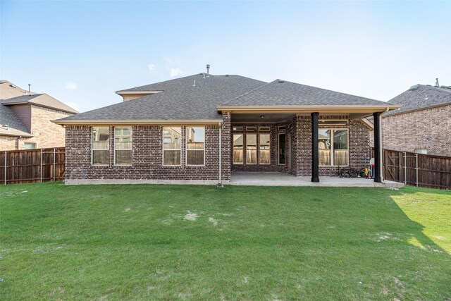 11578 Barcelona Ln, Frisco, TX 75035 - rear view of house with brick siding, roof with shingles, and a patio