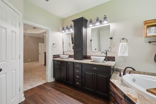 1300 Millers Creek Dr, Prosper, TX 75078 - full bath featuring double vanity, a bath, and wood finished floors