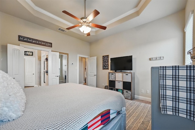 528 England St, Fate, TX 75189 - carpeted bedroom featuring a raised ceiling, baseboards, ceiling fan, crown molding, and a high ceiling