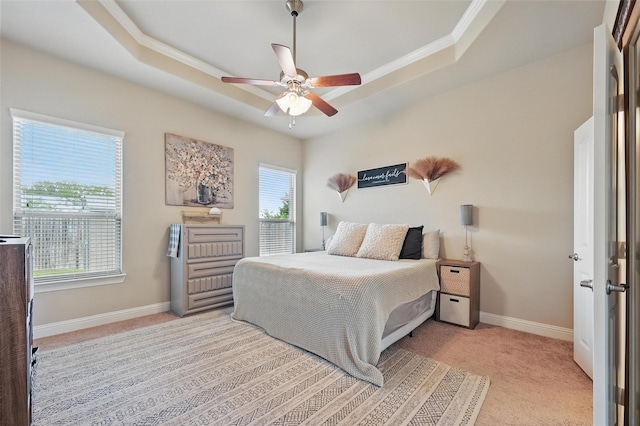 528 England St, Fate, TX 75189 - carpeted bedroom featuring a tray ceiling, crown molding, baseboards, and ceiling fan