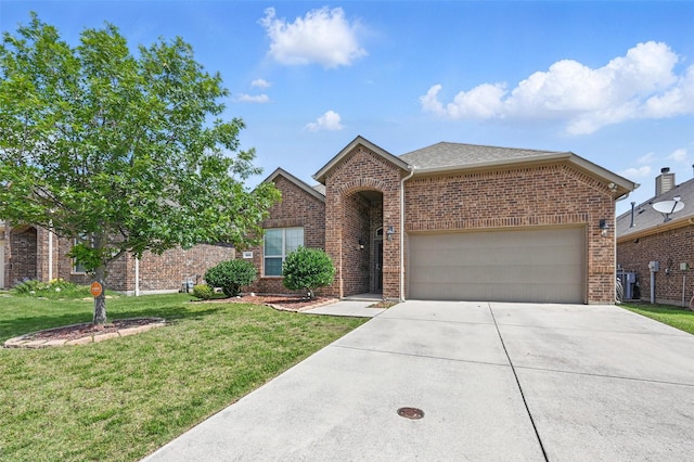 528 England St, Fate, TX 75189 - traditional-style home with brick siding, driveway, central AC unit, a garage, and a front yard