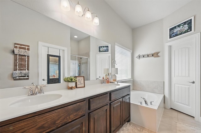 528 England St, Fate, TX 75189 - bathroom featuring a stall shower, double vanity, a bath, and tile patterned flooring