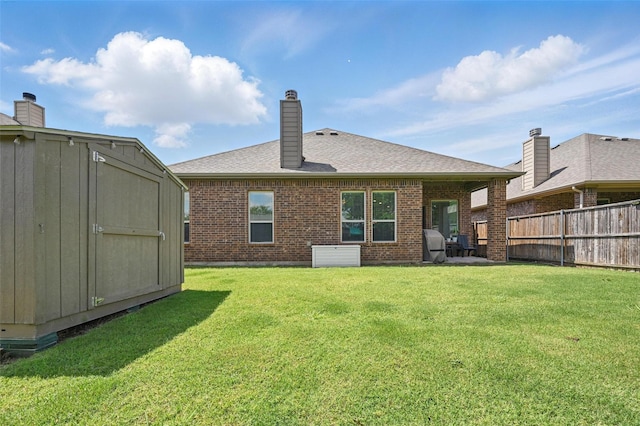 528 England St, Fate, TX 75189 - rear view of house featuring brick siding, a chimney, and a shingled roof