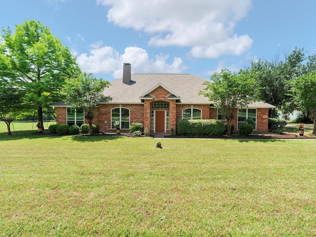 14130 Red Wood Cir S, Frisco, TX 75071 - single story home with a front yard, a chimney, brick siding, and a shingled roof