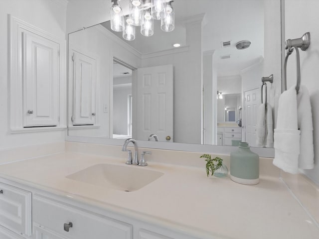 14130 Red Wood Cir S, Frisco, TX 75071 - bathroom with ornamental molding, vanity, and a chandelier