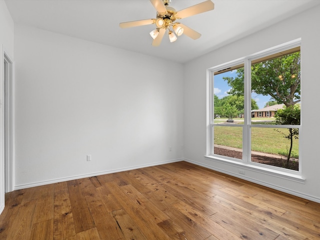 14130 Red Wood Cir S, Frisco, TX 75071 - unfurnished room featuring hardwood / wood-style flooring, baseboards, and ceiling fan