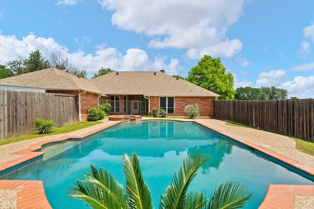 14130 Red Wood Cir S, Frisco, TX 75071 - view of pool with a fenced backyard and a pool with connected hot tub