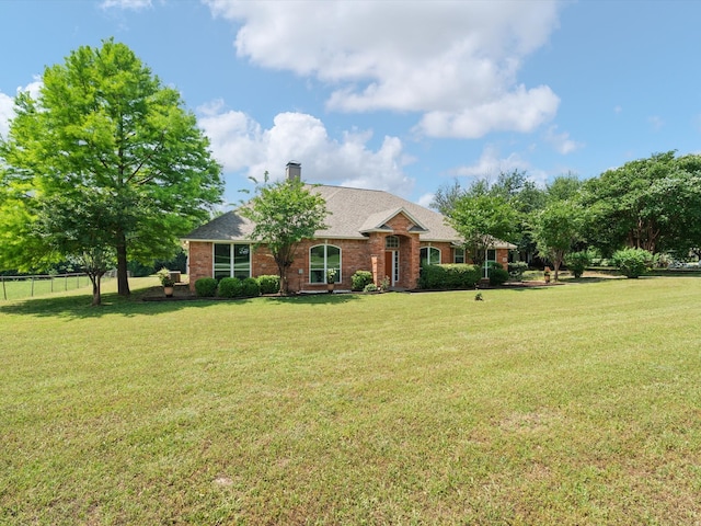 14130 Red Wood Cir S, Frisco, TX 75071 - view of front of property featuring brick siding and a chimney
