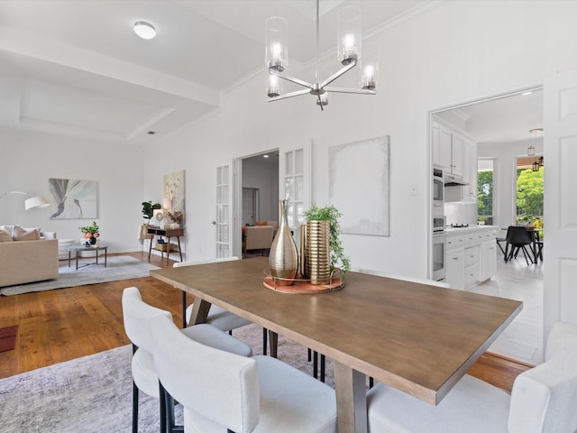 14130 Red Wood Cir S, Frisco, TX 75071 - dining room with a chandelier, light wood-type flooring, ornamental molding, and french doors