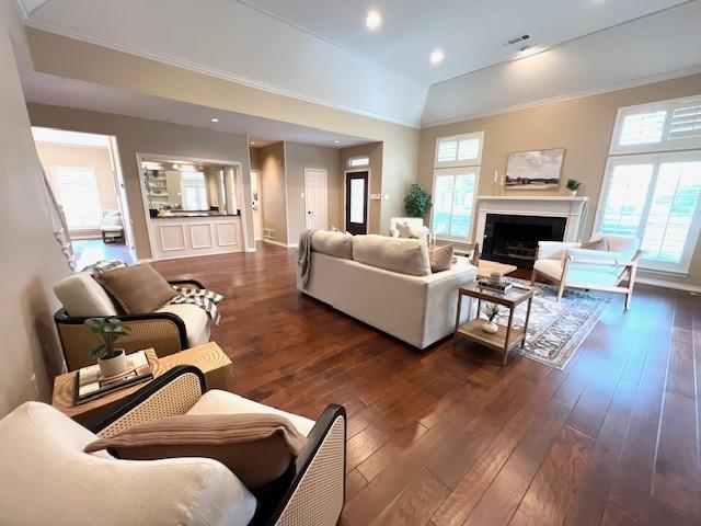 7009 Chevy Chase Ave, Dallas, TX 75225 - living room featuring dark wood finished floors, a fireplace, recessed lighting, crown molding, and baseboards