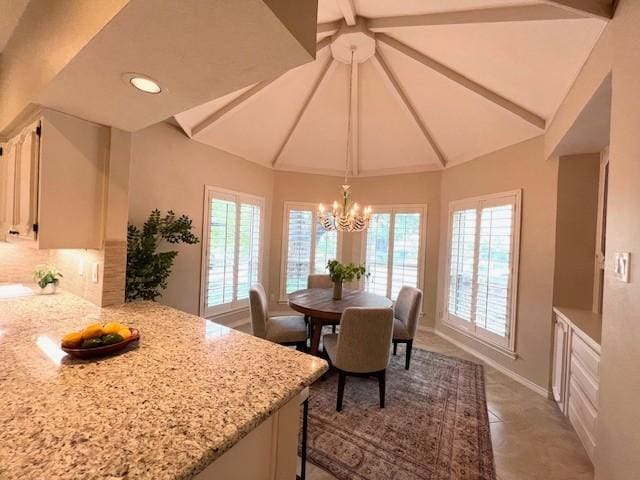 7009 Chevy Chase Ave, Dallas, TX 75225 - tiled dining area with healthy amount of natural light, a chandelier, recessed lighting, and baseboards