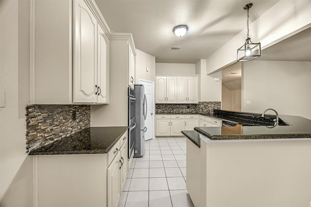 11 Enchanted Ct, Mansfield, TX 76063 - kitchen with a sink, backsplash, a peninsula, white cabinetry, and light tile patterned floors