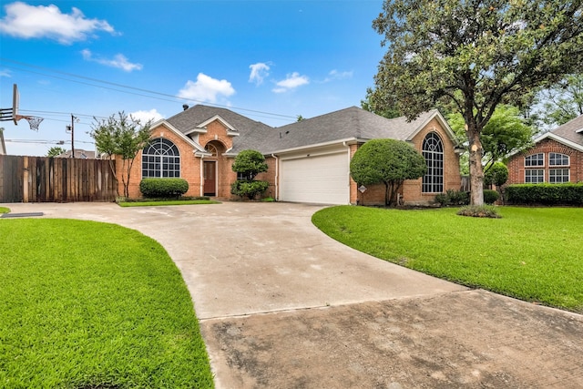 11 Enchanted Ct, Mansfield, TX 76063 - view of front of house featuring brick siding, driveway, a shingled roof, and a garage