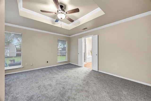 11 Enchanted Ct, Mansfield, TX 76063 - carpeted spare room with a tray ceiling, ceiling fan, ornamental molding, and baseboards