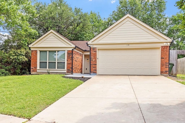 114 Juniper Dr, Arlington, TX 76018 - view of front of home with brick siding, concrete driveway, and a garage