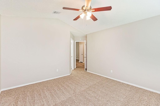 114 Juniper Dr, Arlington, TX 76018 - unfurnished room featuring light carpet, a ceiling fan, vaulted ceiling, and baseboards