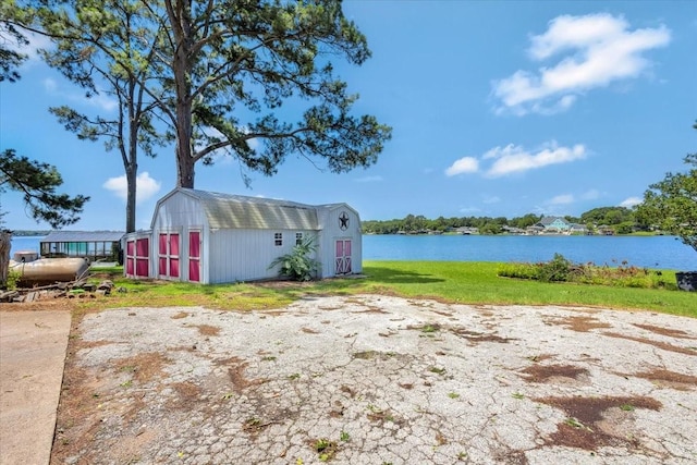 6903 Scott St, Eustace, TX 75124 - view of grassy yard with a water view and an outbuilding