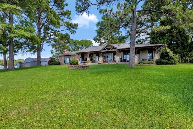 6903 Scott St, Eustace, TX 75124 - back of house featuring a lawn, a chimney, and metal roof
