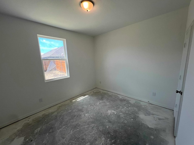 713 Roanoke, Princeton, TX 75407 - empty room featuring unfinished concrete flooring and baseboards