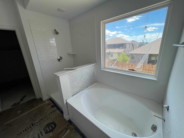 713 Roanoke, Princeton, TX 75407 - bathroom featuring a bath and tiled shower