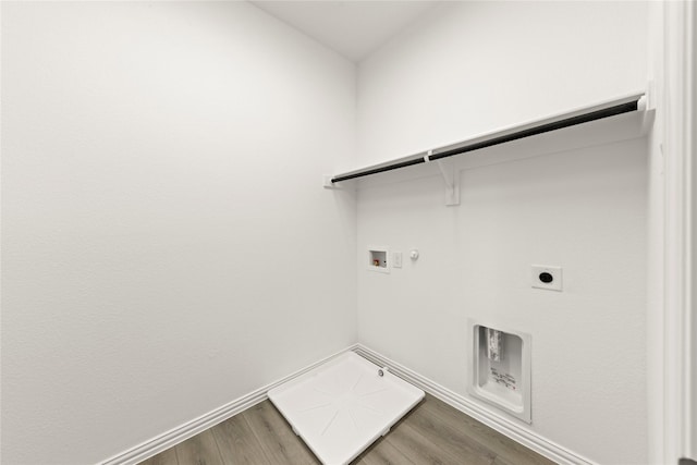 713 Roanoke, Princeton, TX 75407 - laundry room with hookup for a gas dryer, electric dryer hookup, washer hookup, and wood finished floors