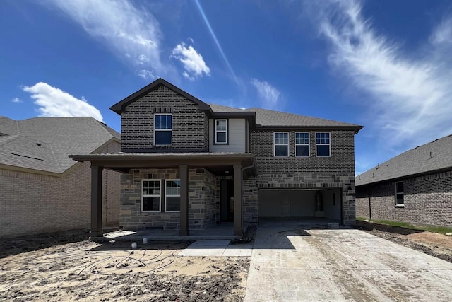 713 Roanoke, Princeton, TX 75407 - view of front facade featuring driveway, an attached garage, stone siding, and covered porch