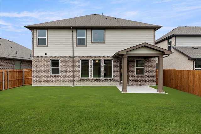 713 Roanoke, Princeton, TX 75407 - rear view of property with a patio, a fenced backyard, and brick siding