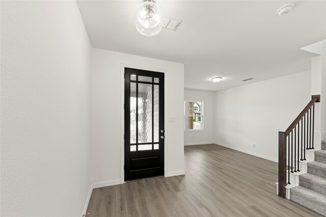 713 Roanoke, Princeton, TX 75407 - foyer featuring wood finished floors and stairway