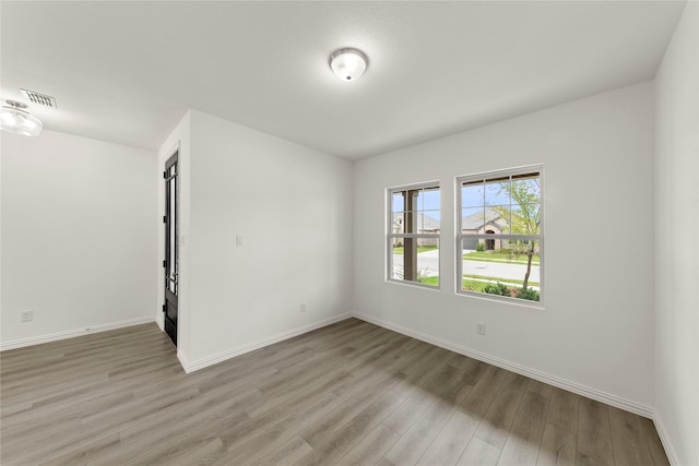 713 Roanoke, Princeton, TX 75407 - spare room featuring wood finished floors and baseboards