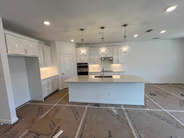 713 Roanoke, Princeton, TX 75407 - kitchen featuring a sink, white cabinets, a center island with sink, recessed lighting, and light countertops