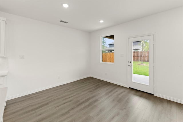 713 Roanoke, Princeton, TX 75407 - unfurnished room with wood finished floors and recessed lighting