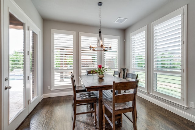15186 Crape Myrtle Rd, Frisco, TX 75035 - dining room featuring a chandelier, baseboards, dark wood-type flooring, and plenty of natural light