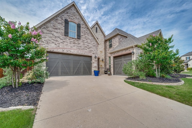 15186 Crape Myrtle Rd, Frisco, TX 75035 - french country style house featuring brick siding and concrete driveway