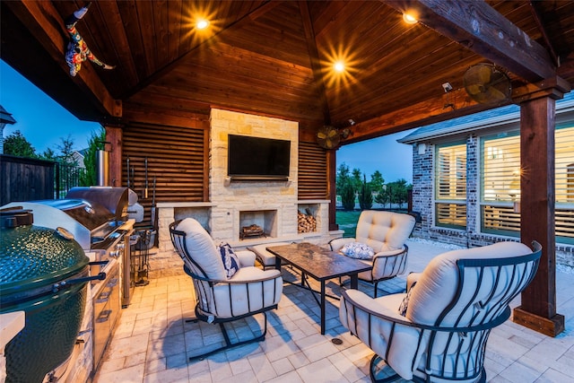 15186 Crape Myrtle Rd, Frisco, TX 75035 - view of patio / terrace with an outdoor living space with a fireplace