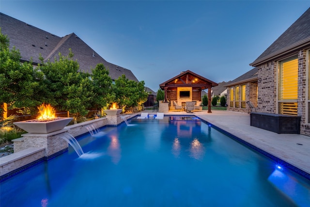 15186 Crape Myrtle Rd, Frisco, TX 75035 - pool at dusk with an outdoor fire pit, a patio area, and a gazebo