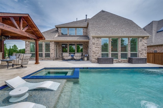 15186 Crape Myrtle Rd, Frisco, TX 75035 - view of swimming pool featuring a patio, a pool with connected hot tub, and an outdoor living space